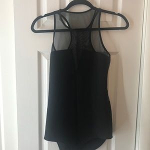 Black body suit with sheer back.